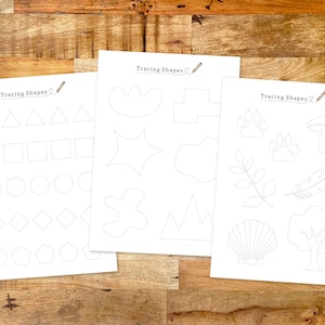 May include: Three printable worksheets with dotted lines for tracing shapes. The first worksheet has basic shapes like triangles, squares, circles, diamonds, and pentagons. The second worksheet has more complex shapes like stars, leaves, and mountains. The third worksheet has shapes like paw prints, mushrooms, feathers, seashells, and trees.