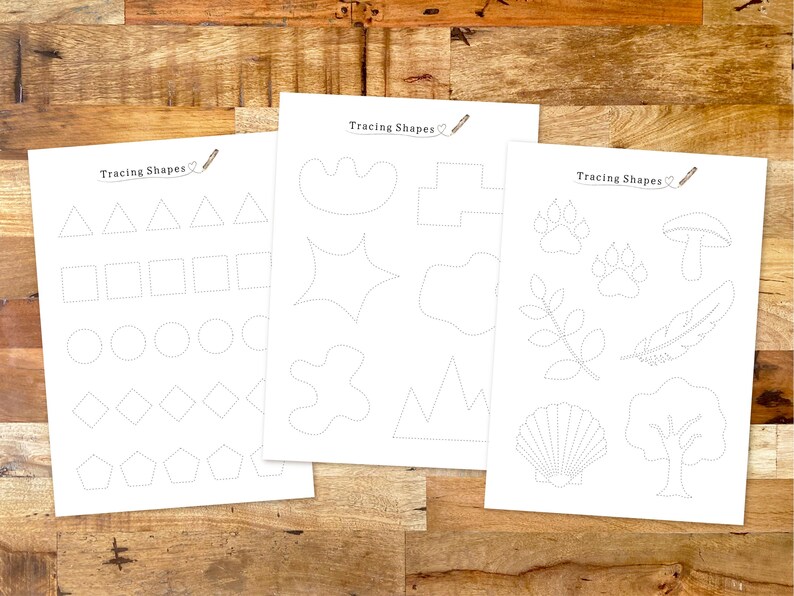 May include: Three printable worksheets with dotted lines for tracing shapes. The first worksheet has basic shapes like triangles, squares, circles, diamonds, and pentagons. The second worksheet has more complex shapes like stars, leaves, and mountains. The third worksheet has shapes like paw prints, mushrooms, feathers, seashells, and trees.