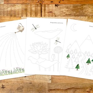 May include: Three black and white coloring pages with different nature scenes. The first page shows a watering can watering a row of plants. The second page shows a lotus flower with two dragonflies. The third page shows a mountain range with a forest and a stream.