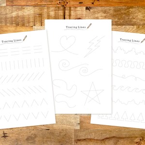 May include: Three printable worksheets with the title "Tracing Lines" and dotted lines for tracing various shapes, including straight lines, zigzags, hearts, stars, and waves.