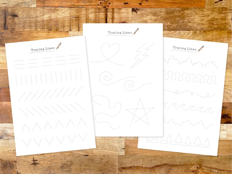 May include: Three printable worksheets with the title "Tracing Lines" and dotted lines for tracing various shapes, including straight lines, zigzags, hearts, stars, and waves.