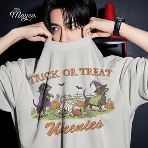retro halloween dachshund png, vintage halloween dog png, vintage weenie dog design, retro wiener dog png, classic halloween dog graphic, vintage spooky season png, retro pumpkin patch png, old school halloween png, dachshund retro design, halloween dog sublimation, retro dog lover png, vintage dog costume png, halloween t shirt png, fall sublimation design, printable halloween png, instant download dog png, vintage dachshund clipart, spooky retro puppy, weenie dog fall design