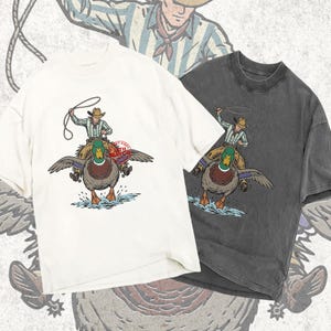 vintage woodcut mallard duck png, retro 1970s duck hunting illustration, 1940s book style duck rider art, rustic screen print western duck graphic, antique style mallard duck shirt design, nostalgic outdoor waterfowl art, distressed western duck clipart, traditional american duck hunting print, vintage lake lodge animal art, classic duck hunter apparel asset, retro wildlife png for sublimation, etched duck riding graphic, western lifestyle duck print, old school duck hunt art file