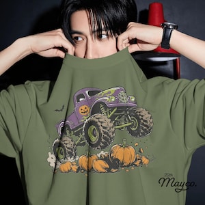 vintage halloween monster truck png, hand drawn pickup truck graphic, purple lime orange halloween palette, lifted truck smashing pumpkins, jack o lantern door design, bats and flame vehicle graphic, giant off road tires illustration, classic spooky truck style, bold outline kids sublimation design, vintage pickup shirt graphic, detailed suspension truck design, halloween vehicle with pumpkins, transparent png digital download, no distressed monster truck graphic, boys halloween pickup truck png