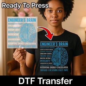 May include: A black t-shirt with the text "ENGINEER'S BRAIN" and a blue brain graphic. The shirt also lists various brain functions. The words "Ready To Press" and "DTF Transfer" are also visible.