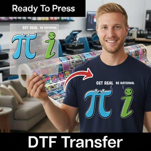 May include: A navy blue t-shirt featuring a graphic print of the mathematical symbol pi in light blue and the imaginary unit i in green, with the text GET REAL BE RATIONAL printed above them in white, alongside a matching clear transfer sheet.