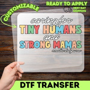 May include: A DTF transfer featuring the phrase "caring for TINY HUMANS and STRONG MAMAS" in colourful block letters. The design includes the hashtag #motherbabynurse and the words "CUSTOMIZABLE" and "READY TO APPLY".