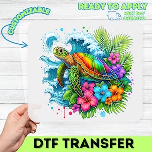 May include: A colorful DTF transfer featuring a sea turtle with a rainbow shell, surrounded by ocean waves, tropical flowers, and palm leaves. The text "CUSTOMIZABLE" and "READY TO APPLY" are also visible.