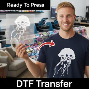 May include: A clear film sheet featuring a white jellyfish graphic with floral details, held up next to a navy blue t-shirt displaying the same white jellyfish design. The text Ready To Press and DTF Transfer is visible at the top and bottom.
