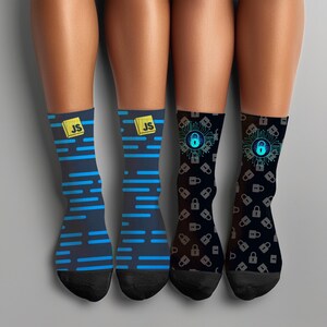May include: Four pairs of socks with distinct designs. Two pairs are dark blue with blue horizontal lines and a yellow "JS" logo. The other two pairs are black with a blue padlock design and a circuit board pattern.