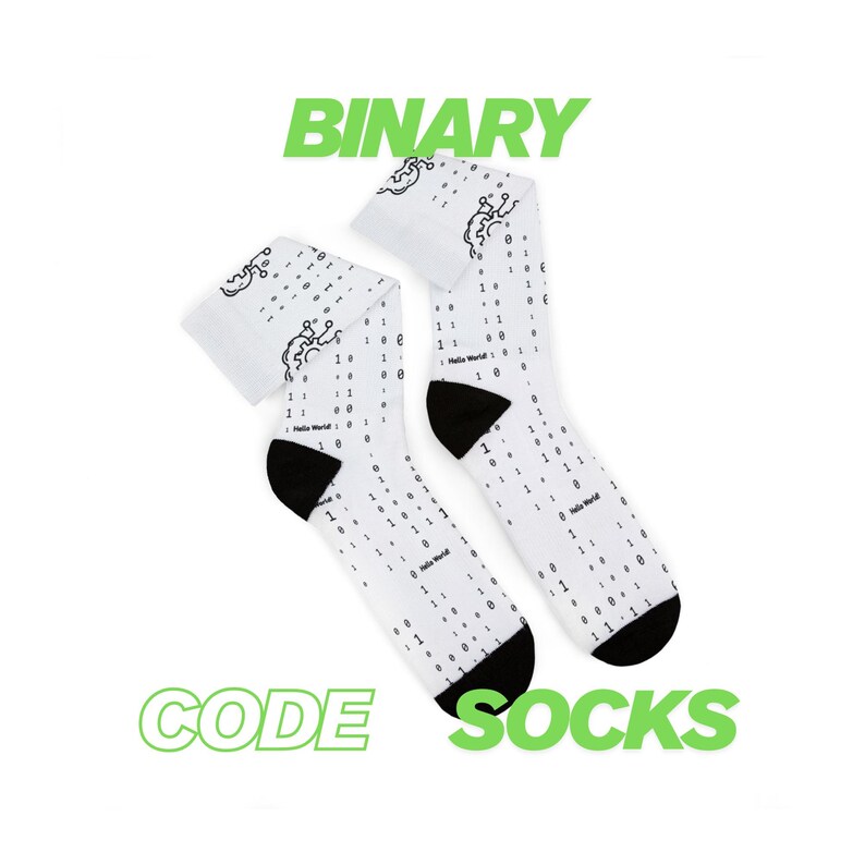 May include: White socks with black heels and toes, featuring a binary code pattern and the text "Hello World!". The socks also have a green text that says "BINARY CODE SOCKS".