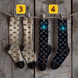 May include: Four pairs of socks hanging on a washing line. Two pairs are beige with a repeating pattern of yellow and black microchips. The other two pairs are black with a repeating pattern of grey padlocks and a blue padlock graphic.