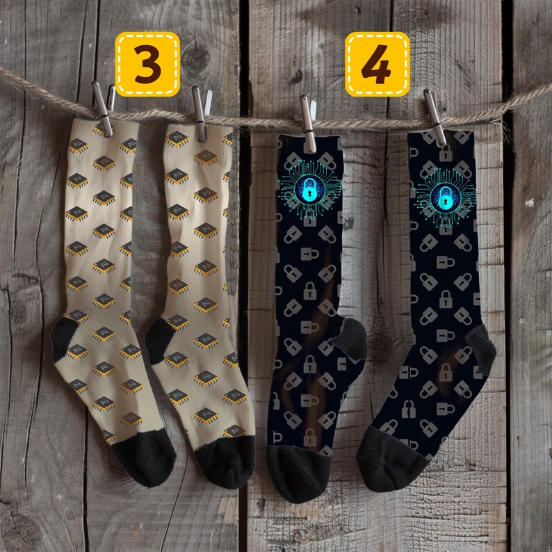May include: Four pairs of socks hanging on a washing line. Two pairs are beige with a repeating pattern of yellow and black microchips. The other two pairs are black with a repeating pattern of grey padlocks and a blue padlock graphic.