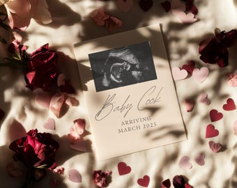 May include: A white card with a black and white ultrasound image and the text "Baby Cook Arriving March 2025". The card is surrounded by pink and red hearts.