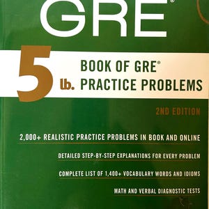 May include: A green book titled "GRE 5 lb. Book of GRE Practice Problems" by Manhattan Prep. The cover features large white text and a gold number "5". Includes online resources and practice problems.