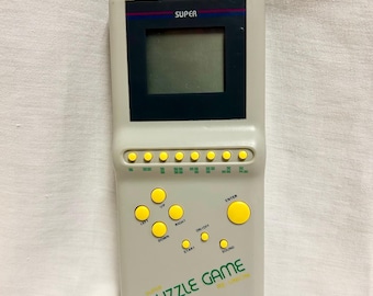 Vintage Handheld PUZZLE GAME TP-507 Electronic Tetras style game looks barely used Great Condition tested and It Works Great