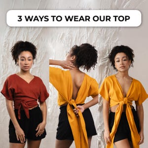 May include: Three images demonstrating different ways to wear a wrap top. The top is shown in rust and mustard yellow, worn with black shorts. The text "3 WAYS TO WEAR OUR TOP" is displayed at the top of the image.