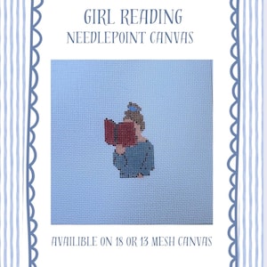 May include: Needlepoint canvas featuring a pixelated illustration of a person reading a book. The image is set against a light blue background and framed with a scalloped border. Text at the top reads "GIRL READING NEEDLEPOINT CANVAS".