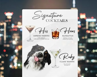 May include: A clear acrylic sign displaying "Signature Cocktails" with illustrations of Espresso Martini, Manhattan, and Classic Martini. A black and white dog is pictured below the drinks. The sign is on a dark surface with a city skyline background.