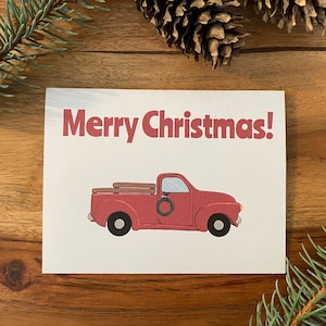 Carte de Noël / Fêtes / Hiver - Dites « Joyeux Noël » cette saison avec ce joli camion rouge avec une couronne. Options individuelles ou groupées