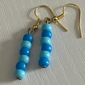 Blue, gold beaded earrings