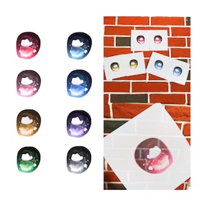 May include: A collection of colorful, glossy anime-style eye decals. The eyes feature various color combinations, including pink, blue, gold, green, and purple. Some decals are on white cards, while others are loose. The background is a red brick wall.