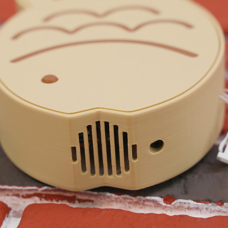 Taiyaki Fish Shaped Portable Fan held by a hand, illustrating its perfect fit for easy portability and usage. The fan’s fun and cute Japanese street snack-inspired design makes it a must-have for anime and kawaii fans, and the 3D printed PLA construction ensures it’s sturdy and environmentally friendly. Whether you’re headed to a summer festival, gaming marathon, or vacation getaway, this USB rechargeable fan delivers a three-speed breeze to keep you comfortable and cool.