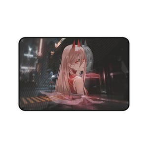 May include: Rectangular mousepad featuring an anime-style illustration of a character with long, light hair, red eyes, and horns. The character is set against a blurred cityscape background with neon lights. The mousepad has a black border.