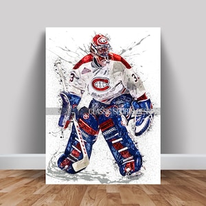 May include: A hockey goalie in a white, red and blue uniform with a red and blue helmet makes a save. The goalie is wearing a red and blue jersey with the number 3 on the front and the Montreal Canadiens logo on the chest. The goalie is also wearing red and blue pads and a red and blue glove. The background is white with splashes of paint.