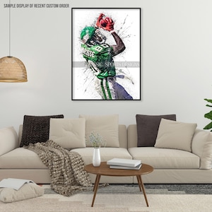 May include: A watercolor painting of a football player in a green and white uniform catching a red football. The background is white with splatters of paint.