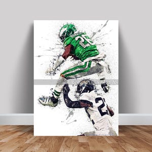 May include: A digital painting of two football players in action. The player in green is jumping in the air, while the player in black and white is attempting to tackle him. The background is a white splatter pattern.