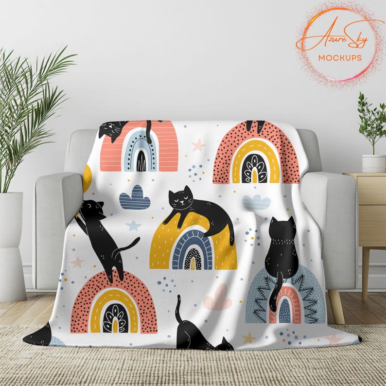 May include: A white throw blanket with a repeating pattern of black cats and colorful rainbows. The blanket features a whimsical design with a modern aesthetic.