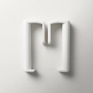 May include: Two white, minimalist plastic coat hangers. Each hanger has a cylindrical vertical support and a curved top with a hook. The hangers are set against a plain white background.