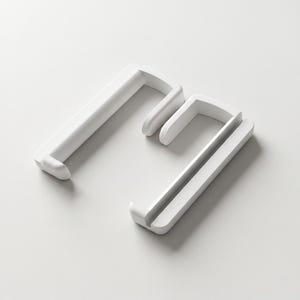 May include: Two white, L-shaped shelf brackets with a minimalist design. The brackets are made of a solid, smooth material and have a simple, modern aesthetic. The brackets are displayed on a white background.