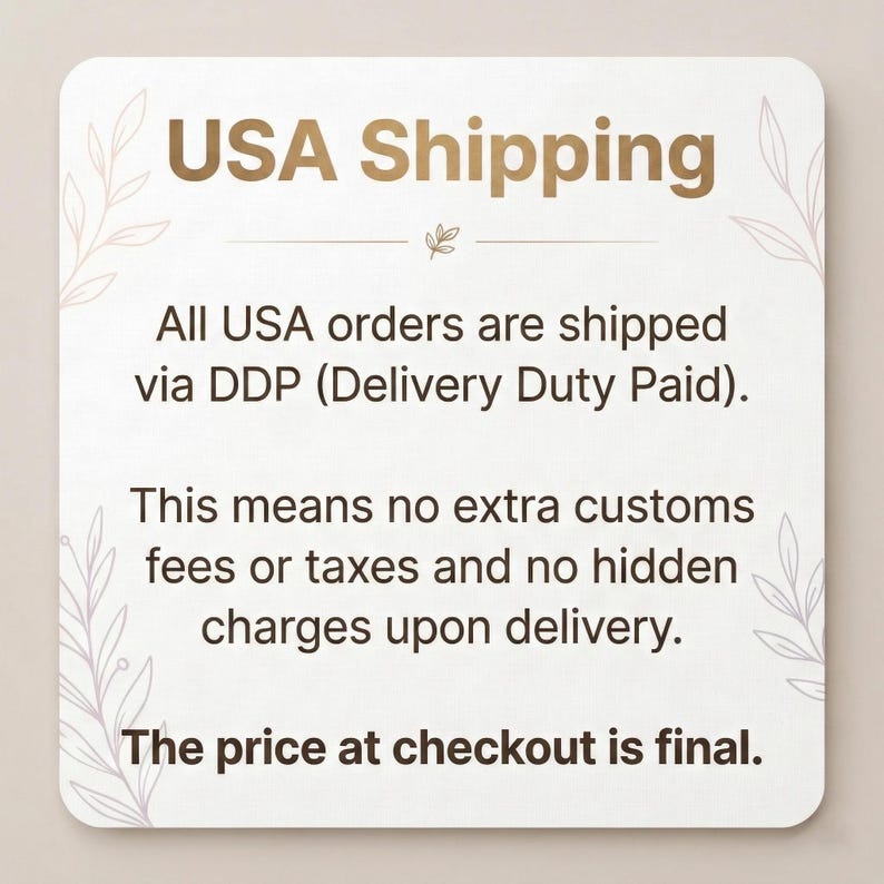 May include: A square, off-white card with rounded corners displays "USA Shipping" in gold. The card details shipping information, stating orders are shipped via DDP, with no extra fees or taxes, and the price at checkout is final.