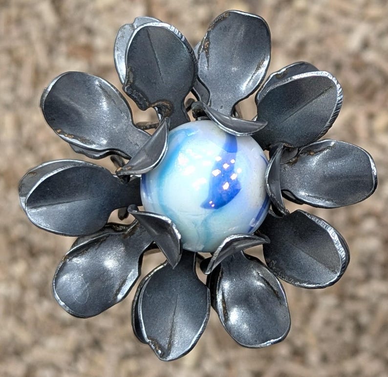 Metal Mum Garden Stake: Rusty Steel Flower with Glass Marble white w/ blue swirls