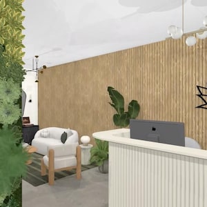 May include: A modern spa reception area with a white reception desk, two computer monitors, and a black metal lotus flower wall decor. The room has a light wood wall and a green wall with plants.