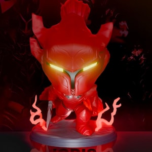 May include: A red and yellow glowing figurine of a knight with a sword. The knight is standing on a circular base with a glowing red design. The base has the word "IGRIS" printed on it.