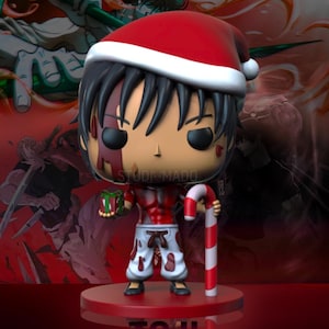 May include: A Funko Pop figure of a character wearing a Santa hat, holding a wrapped gift and a candy cane. The figure has black hair and is wearing white pants with red accents. The base is red, and the background is a blurred image.