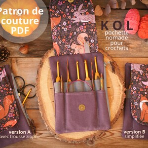 May include: A purple fabric pouch with a zippered pocket and a flap that closes with a button. The pouch is filled with crochet hooks and has a fox print on the flap. The pouch is labeled "KOL pochette nomade pour crochets" and has two versions: "version A avec trousse zippée" and "version B simplifiée".