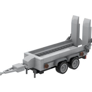 May include: A light gray toy trailer with two wheels, a hitch, and a loading ramp. The trailer has a rectangular bed with a series of small, dark gray blocks. The trailer's dimensions are approximately 12 inches long.