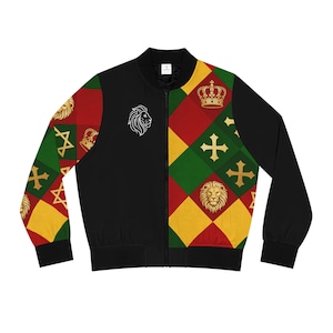 May include: Black bomber jacket with a zip fastening. The jacket features a lion graphic and a pattern of red, green, and yellow diamonds, crosses, and crowns. The sleeves have a repeating pattern of gold lions, crowns, and stars.