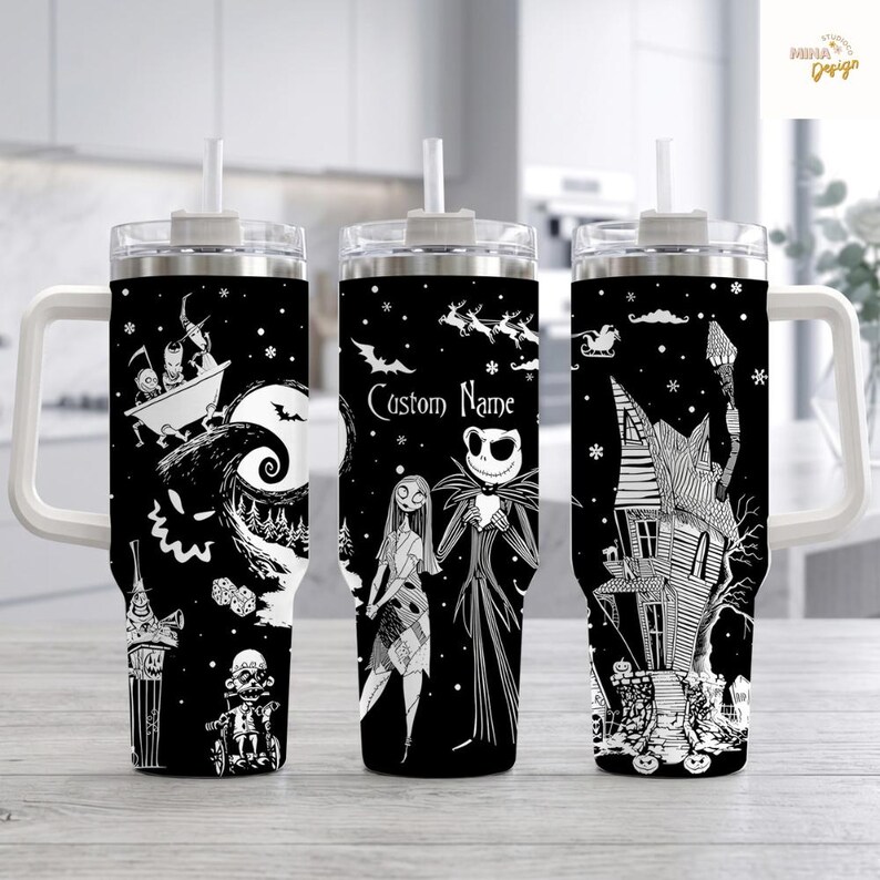 May include: Three black and white tumblers with handles and straws, featuring a repeating pattern of characters and scenes from The Nightmare Before Christmas. The center tumbler displays the text Custom Name above two central character figures.