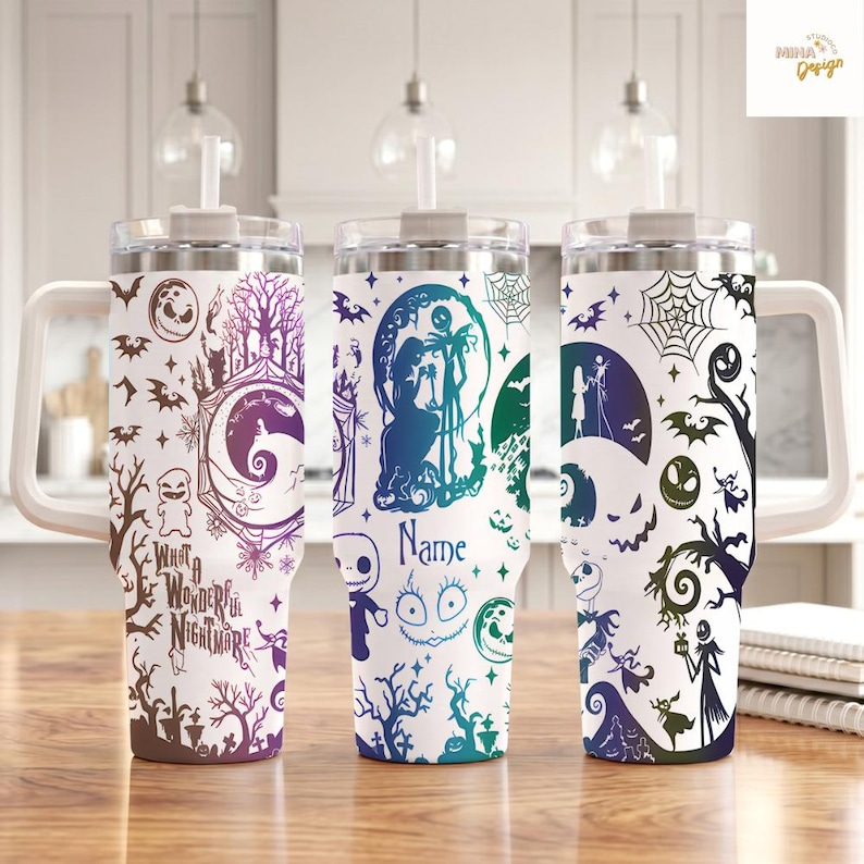 May include: Three white tumblers with handles and straws, featuring a colorful pattern of characters, trees, spiderwebs, and bats. The text "What A Wonderful Nightmare" and "Name" are printed on the tumblers in a stylized, dark blue and purple font.