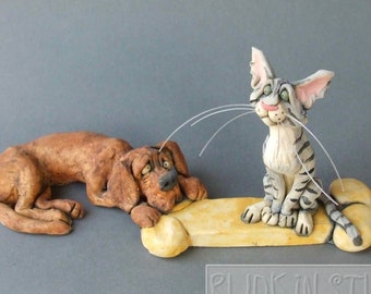 Cat and Dog on Bone Ceramic Animal Sculpture