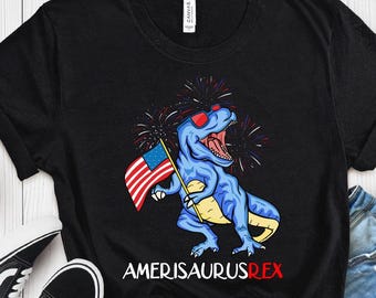 -shirt Dinosaure Amerisaurus Rex tenant le drapeau américain | Feux d'artifice du jour de l'indépendance | Chemise 4 juillet Enfant