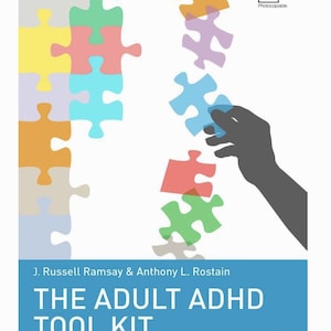 May include: Book cover with a white background and colorful puzzle pieces. The title "THE ADULT ADHD TOOL KIT" is displayed in large, bold letters. The book is by J. Russell Ramsay & Anthony L. Rostain.