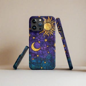 May include: A purple, blue, and gold phone case with a stained glass design of a sun, moon, and stars.