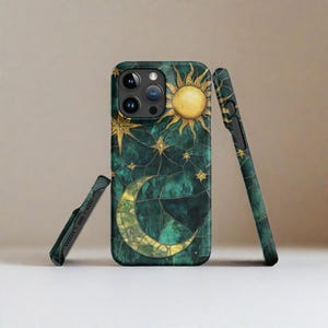 May include: A green and gold phone case with a crescent moon and sun design. The case has a cracked glass effect and is decorated with gold stars.