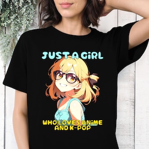 May include: Black t-shirt with a cartoon anime girl wearing glasses and the text "Just a girl who loves anime and k-pop".